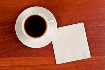 Obraz na płótnie Canvas Cup of coffee and napkin