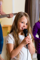 Children playing in a band making music