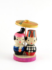 Couple of wooden Vietnamese doll with national costume isolated