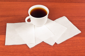 Cup of coffee and napkin