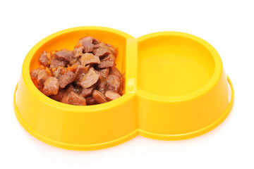yellow bowl with cat food and water isolated on white