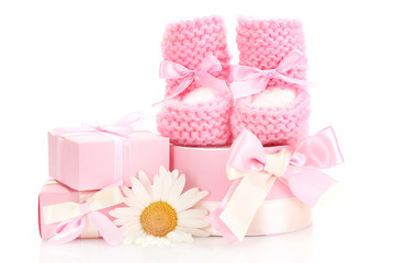 pink baby boots, gifts and flower isolated on white