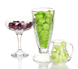 Color candies in glasses isolated on white
