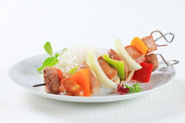 Pork skewers with rice