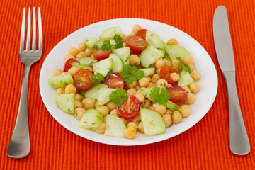 vegetable salad with chick-pea on the plate