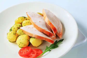 Roast turkey breast and potatoes