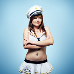 Pretty girl in a sailor suit shy