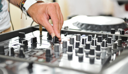 Working Disc jockey at party. Detail of a dj hands.