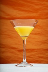 yellow cocktail on orange background