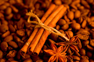 Coffee beans and cinnamon background