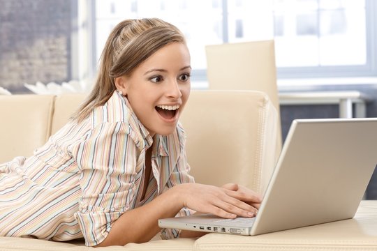 Surprised woman with laptop
