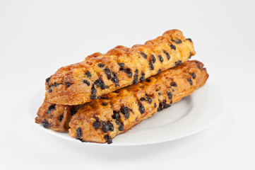 Bread, chocolate chip bars on a white plate.