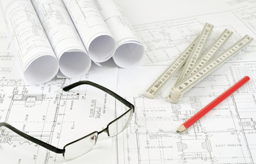 construction plans and glasses