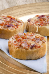 mini bruschetta on a paper napkin