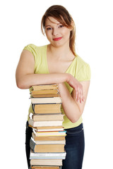 Young caucasian woman (student) with books