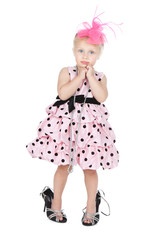 Glamour little girl trying on her mother's black shoes over whit © Iuliia Metkalova