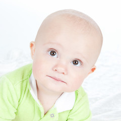 Bright closeup portrait of funny baby boy