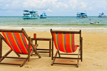 Two chairs on the beach of Koh Samet, Thailand.