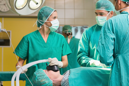 Surgeon looking at a nurse