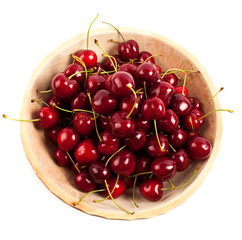 Obraz na płótnie Canvas Cherries in a wooden bowl