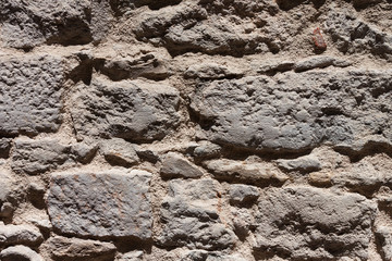 Closeup vintage grey stone wall texture background