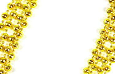 Background made of a brilliant celebratory beads of golden color