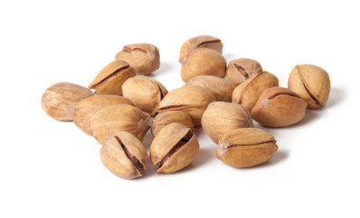 pistachios heap against white background