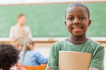 Pupil standing in classroom