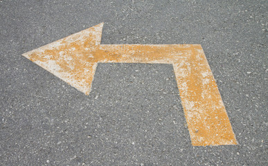 yellow arrow on the road.