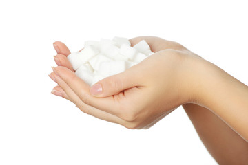 Woman's hands full of sugar cubes.