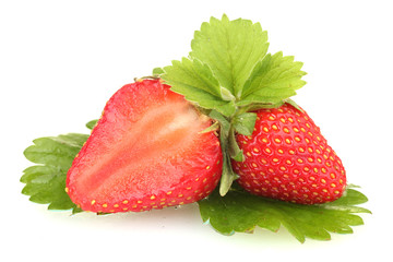 sweet ripe strawberries with leaves isolated on white