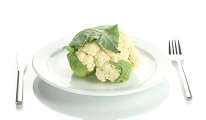 Fresh cauliflower on plate, knife and fork isolated on white