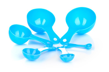 Blue measuring spoons isolated on white