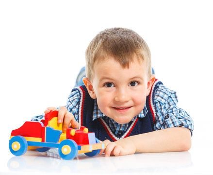 Cute boy plaing on floor