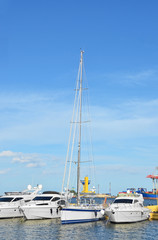 Fototapeta premium White motor yacht over harbor pier, Odessa, Ukraine