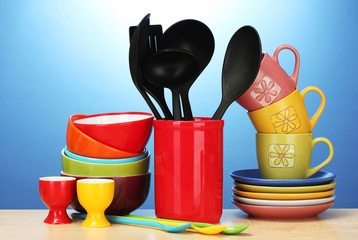bright empty bowls, cups and kitchen utensils