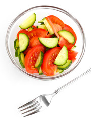 Fresh salad with tomatoes and cucumbers isolated on white