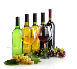 bottles and glasses of wine and ripe grapes isolated on white