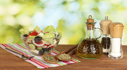 tasty greek salad on bright green background