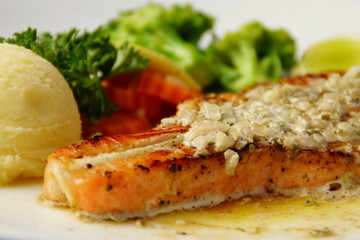 Grilled Salmon Steak Served with Lemon Sauce