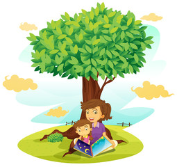 Obraz na płótnie Canvas Chłopiec i dziewczyna studiuje pod drzewem