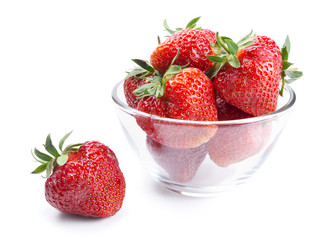 Glass bowl with strawberries isolated on white