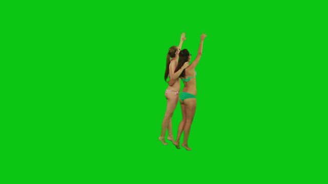 Two summer girls waving to the distance