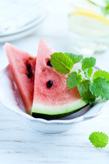Sliced water melon with lemon mint in a bowl