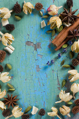 Dry spices and herbs on the vintage wooden surface frame