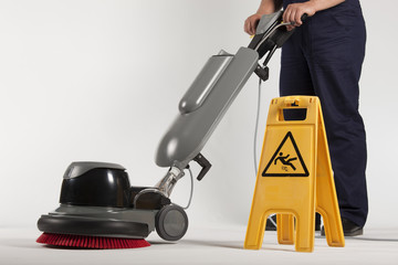 cleaning floor with machine
