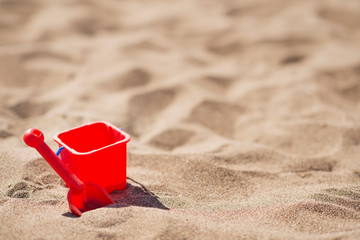 Fototapeta na wymiar Baby bucket and shovel on the sandy beach