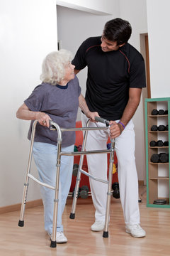 Therapist helping Patient use Walker