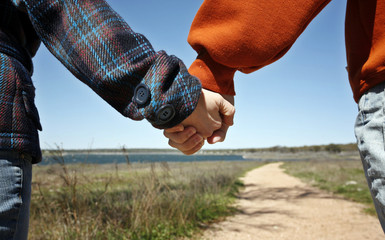 Young couple holding hands (happy family relationships contest)