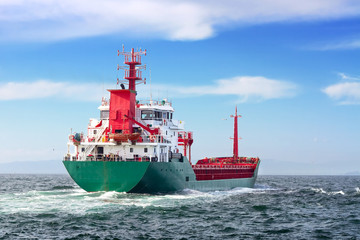 Tanker ship sailing into the open sea